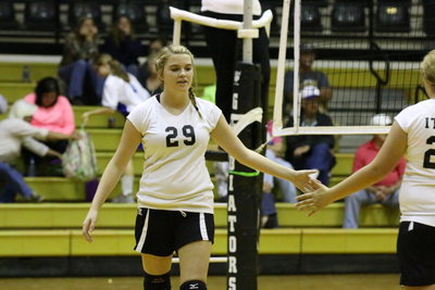 Image: Grace Haight(29) gives Brycelen Richards(23) five after an Italy point.