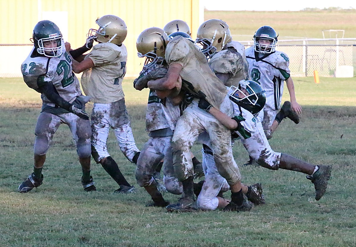 Image: Believe it or not, Italy running back Jonathan Salas(22) breaks out of this tackle to score a touchdown for Italy thanks to blocking help from Jacob Wiser(74) and Adam Powell(24).