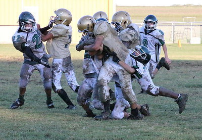 Image: Believe it or not, Italy running back Jonathan Salas(22) breaks out of this tackle to score a touchdown for Italy thanks to blocking help from Jacob Wiser(74) and Adam Powell(24).