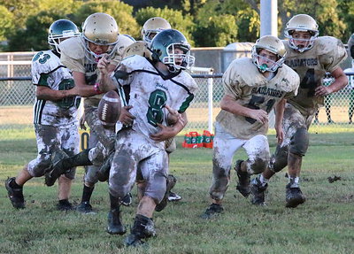 Image: Jonathan Salas(22) strips the Bobcat quarterback and then recovers the fumble as Jacob Wiser(74), Cason Roberts(51) and Isaac Garcia(54) track the play.