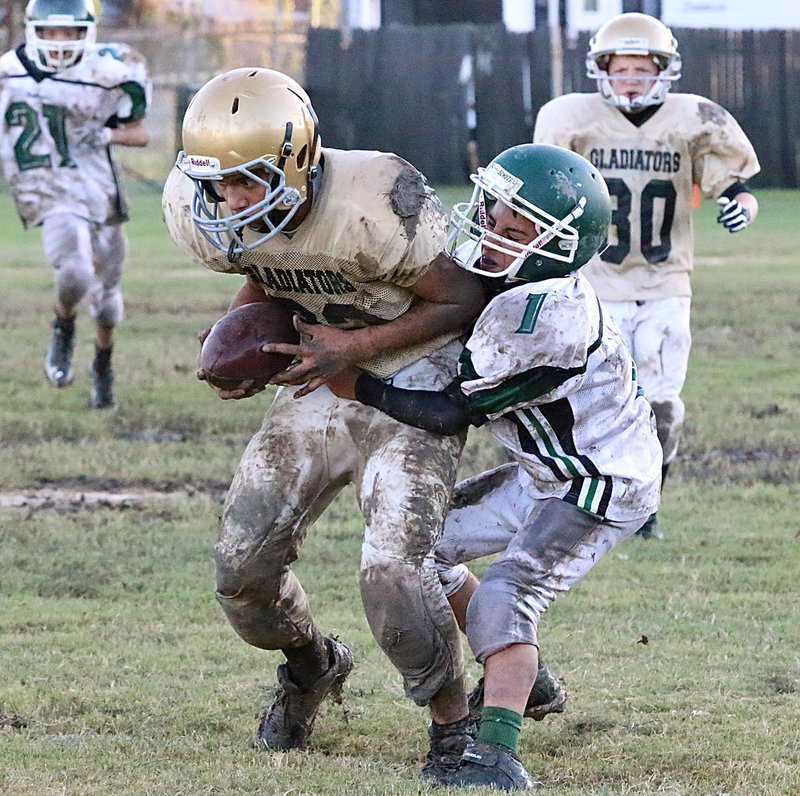 Image: Picking up the fumble and running with it is Italy’s Jonathan Salas(22).