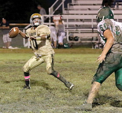 Image: Quarterback Tylan Wallace(10) goes downfield to Gary Escamilla who makes the catch for the duos second passing touchdown of the game.