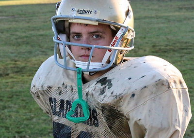 Image: 7th grader Cason Roberts(51) and his Italy teammates used the mud to bury the Bobcats, 28-0.