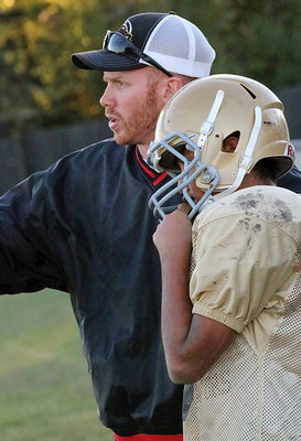 Image: Italy Junior High head coach Jon Cady sends in a play.
