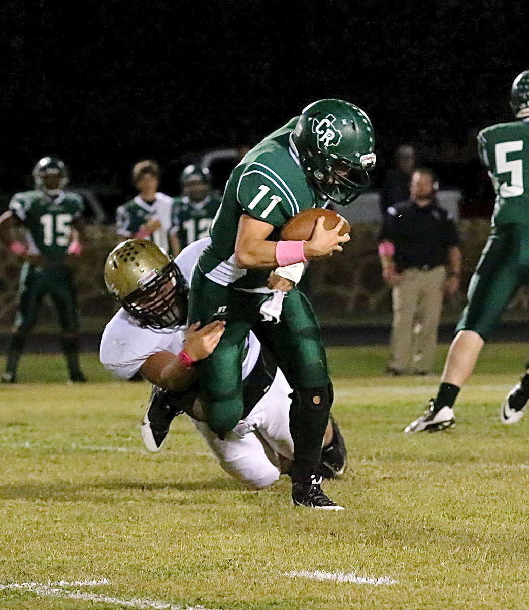 Image: Italy Gladiator senior defensive end Zain Byers(50) tackles a Bobcat for a loss early in the first-half. Italy held off a late rally by Crossroads to win 41-30 and improve to 2-0 in district play.