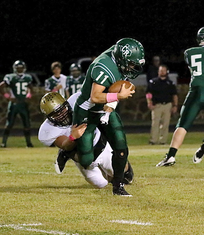 Image: Italy Gladiator senior defensive end Zain Byers(50) tackles a Bobcat for a loss early in the first-half. Italy held off a late rally by Crossroads to win 41-30 and improve to 2-0 in district play.