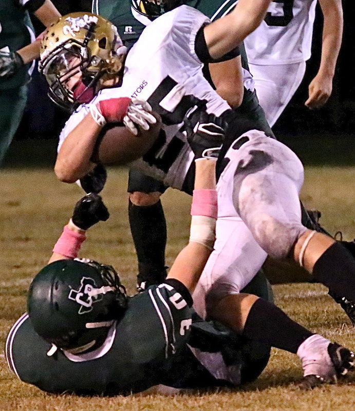 Image: Italy fullback Shadrach Newman(25) plows over a Bobcat tackler in the mud.