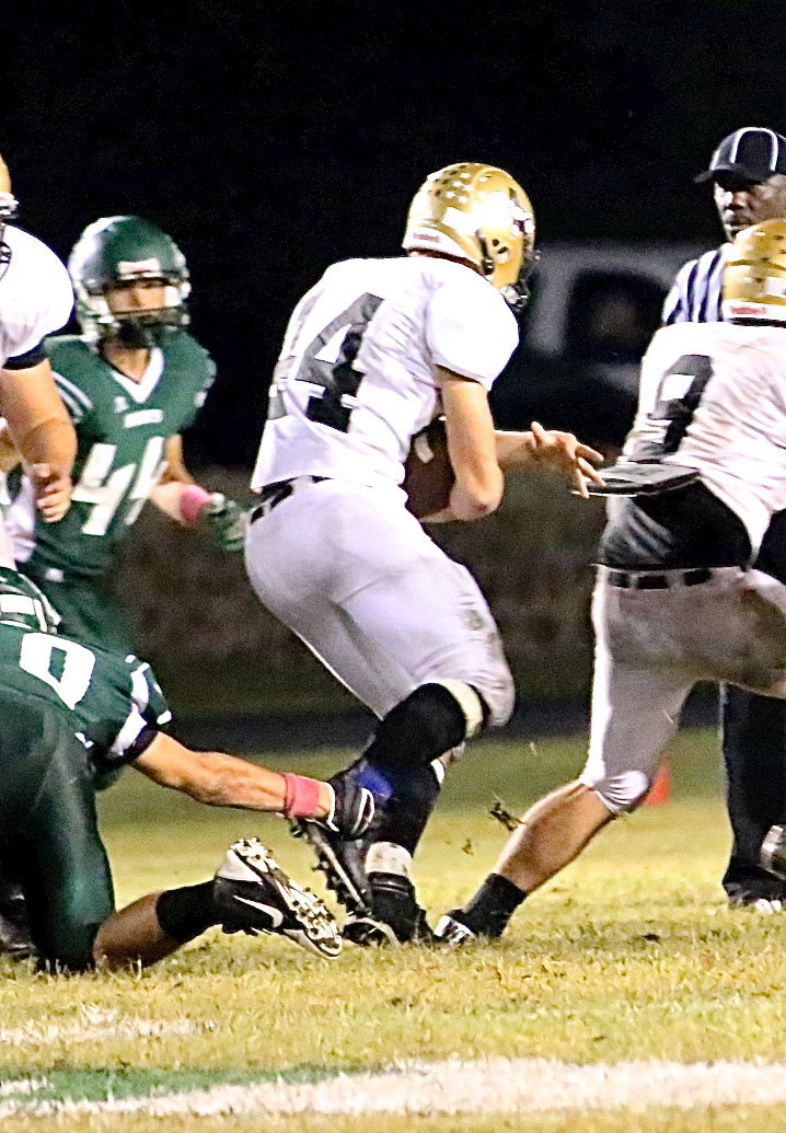 Image: Gladiator back Coby Bland(44) maneuvers for yards behind a block by Hunter Merimon(9).