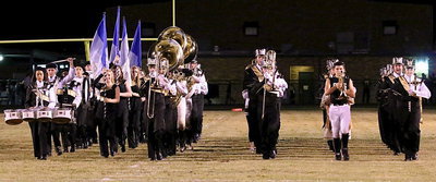 Image: The Gladiator Regiment Marching Band and Color Guard begin their halftime performance.