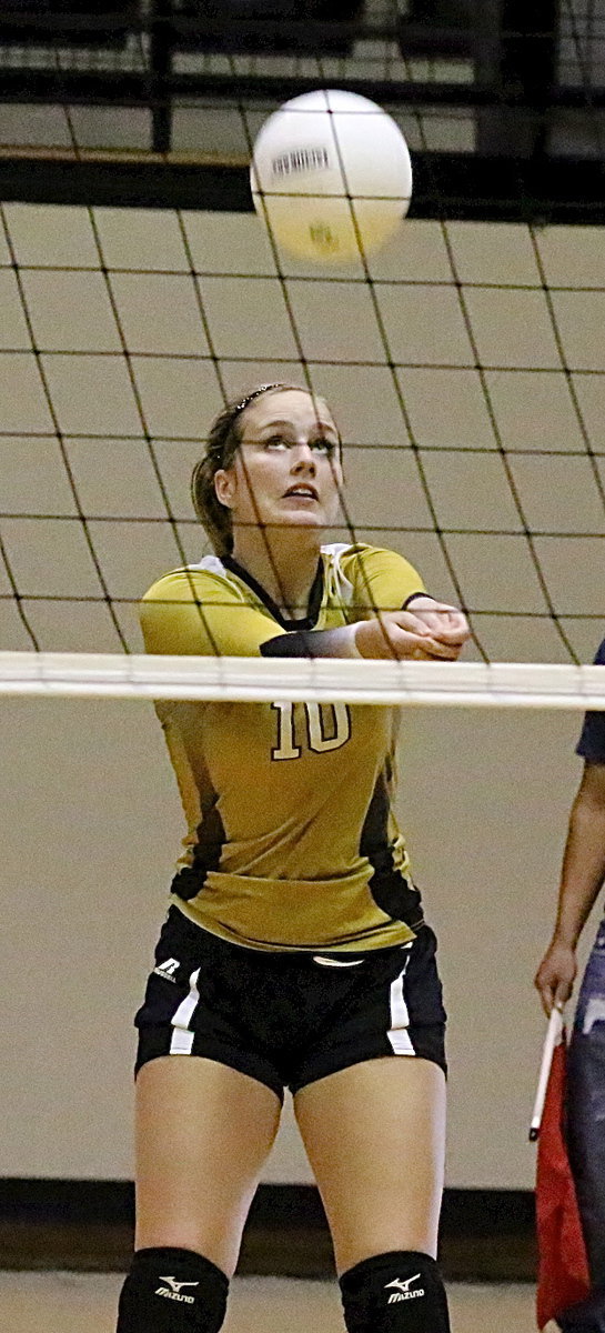 Image: Madison Washington(10) bumps the ball up so teammates can make a play.