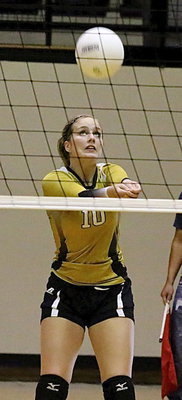 Image: Madison Washington(10) bumps the ball up so teammates can make a play.