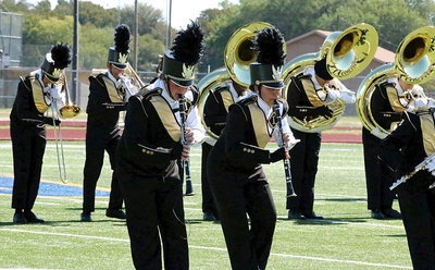 Image: Trevor Patterson and Vanessa Cantu join their band mates in setting the mood during an emotional routine.