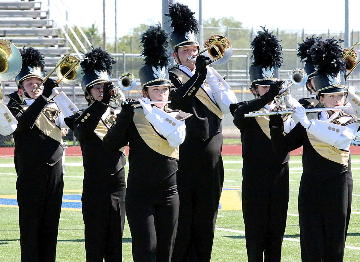Image: Sarah Levy, Zac Mercer and Kristen Viator join their fellow band members in using their instruments of war.