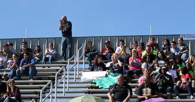 Image: Italy High School principal Lee Joffrey leads the cheers as the Italy student body makes some noise for the band following their performance.