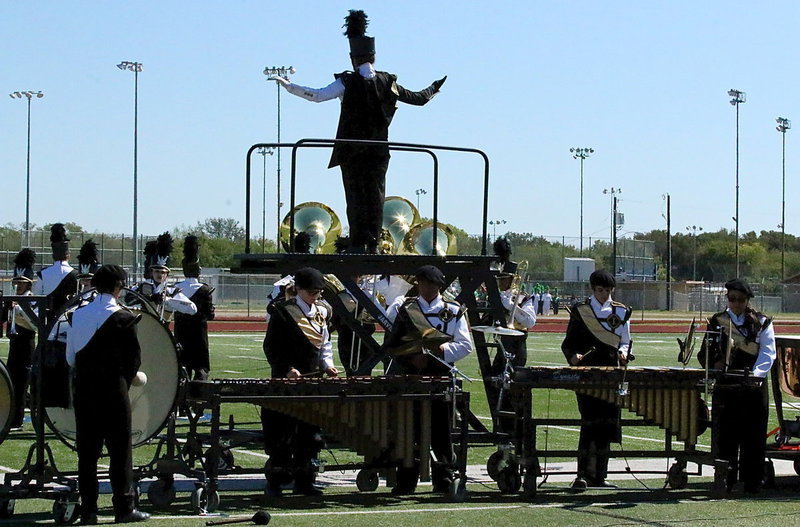 Image: Drum major Alexis Sampley helps lead  the Gladiator Regiment Band and Color Guard to victory!