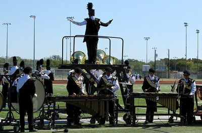 Image: Drum major Alexis Sampley helps lead  the Gladiator Regiment Band and Color Guard to victory!