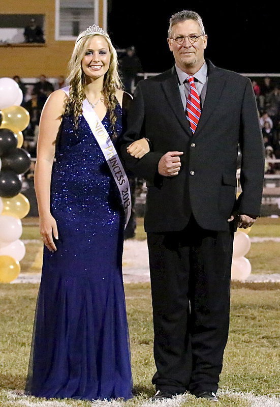 Image: 2013 junior Princess, Madison Washington is escorted by her grandpa, David McClendon.