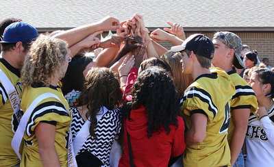 Image: Senior Gladiators Kevin Roldan, Shad Newman, Justin Wood and Cody Medrano join their classmates in the senior circle following the downtown homecoming pep rally.