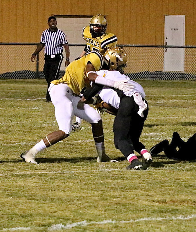 Image: Safety Trevon Robertson(3) slings down a Cayuga runner.