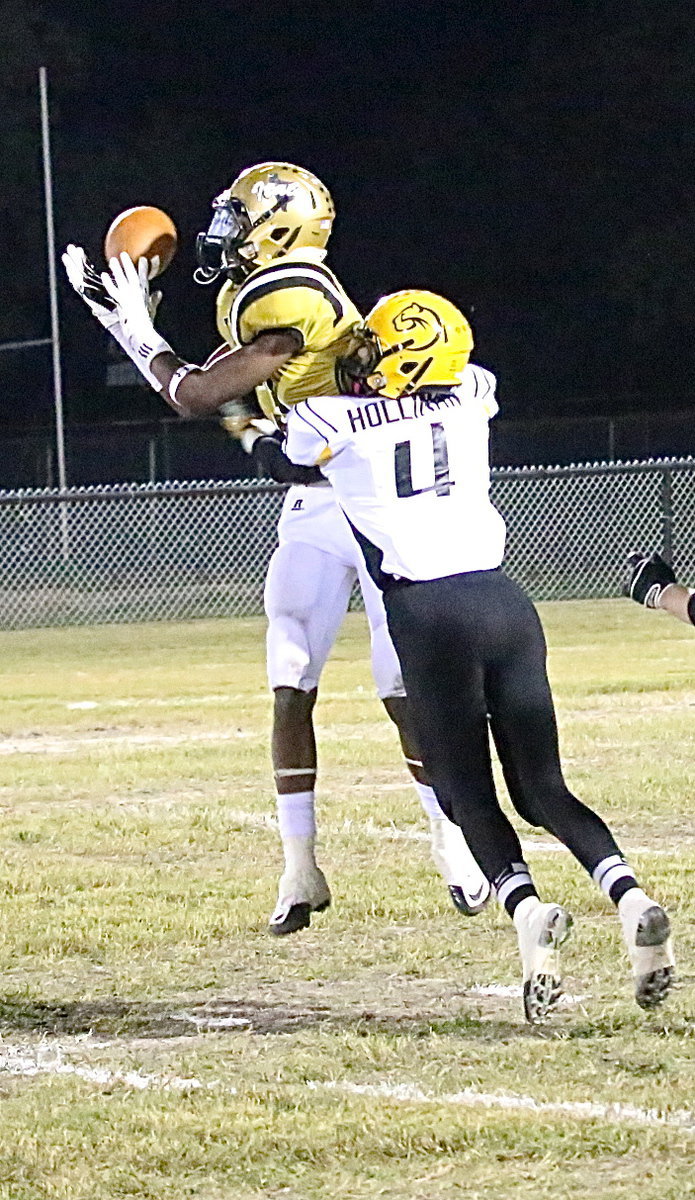 Image: Trevon Robertson(3) breaks up a Cayuga pass attempt.