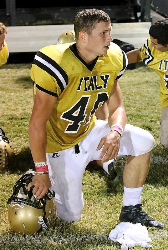 Image: Junior Coby Bland(40) takes a knee and a well deserved breather during an injury time-out.