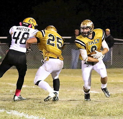 Image: Fullback Shad Newman(25) blocks a Cayuga linebacker to make room for Hunter Merimon(9) who finished with 82 yards rushing.