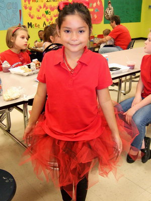 Image: Serenity Roath dressed in red.