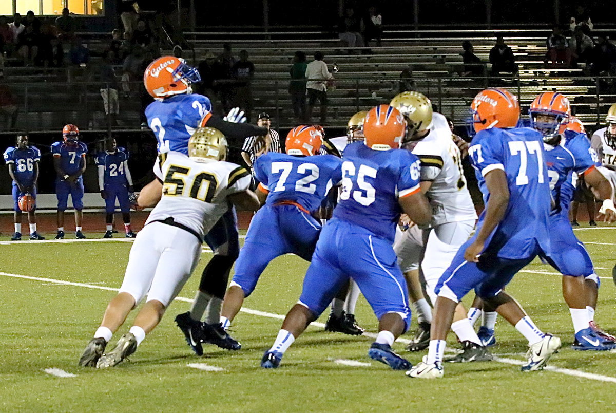 Image: A key moment in the game and with Italy trailing 24-7, Gladiator defensive end Zain Byers(50) forces an interception while injuring the Gator quarterback with this rib shot just before halftime. The Gator QB returned but was tentative in the second-half, according to Byers. Gateway was unable to score again which allowed Italy to rally for a 28-24 win.