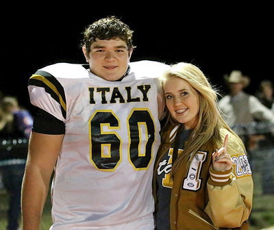 Image: Stat Squad girl Hannah Washington congratulates Kevin Roldan(60) after the game.
