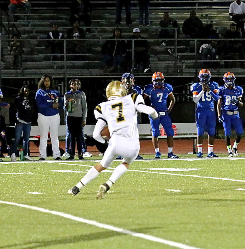 Image: Ryan Connor(7) catches a line driving kickoff above his head and then tucks the ball and runs to give Italy good field position.