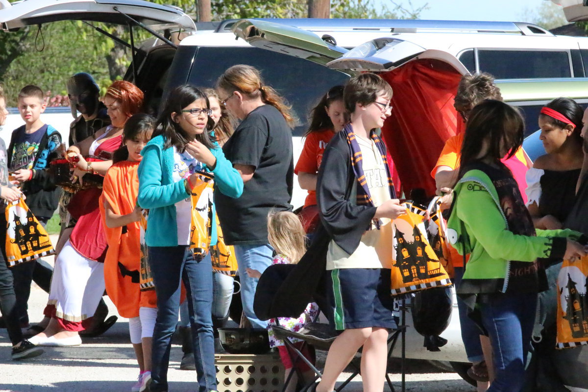 Image: Stafford’s trick-or-treaters keep visiting trunk after trunk.
