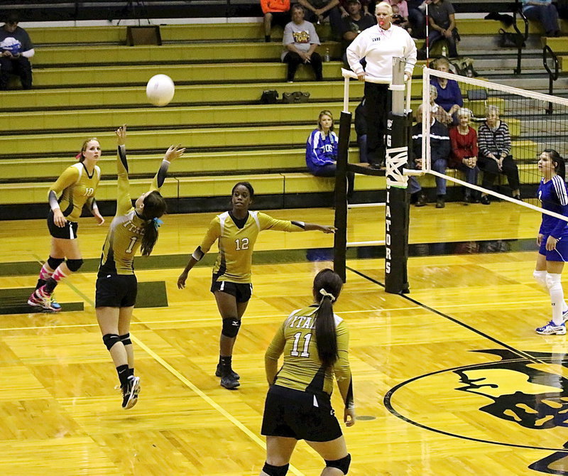 Image: Bailey Eubank(1) sets the ball for teammates Madison Washington(10) and senior Paige Westbrook(11).