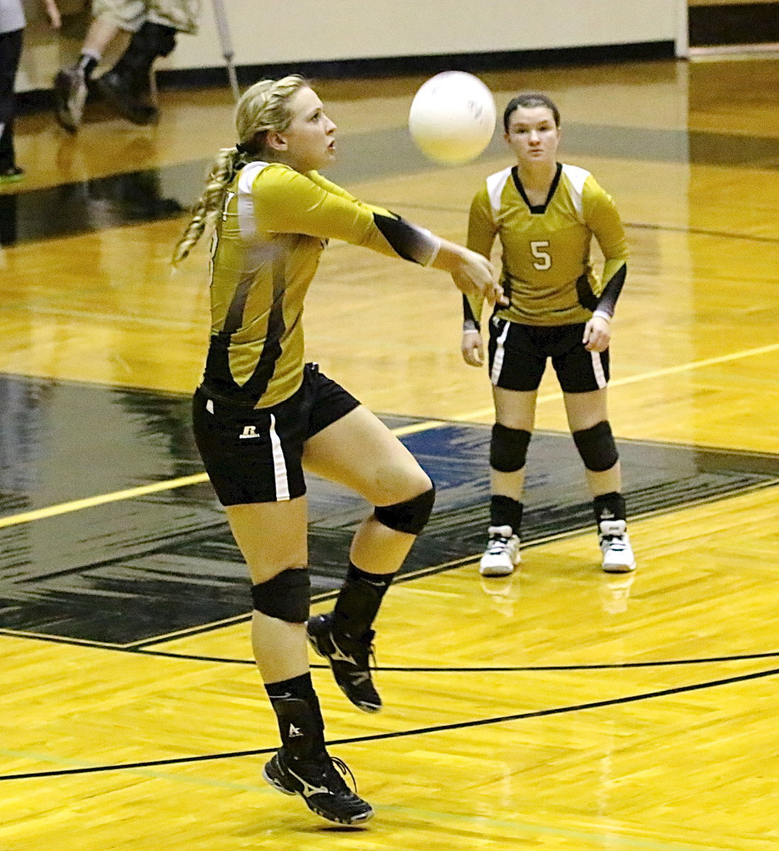 Image: Jaclynn Lewis(13) bumps the ball up to her teammates.