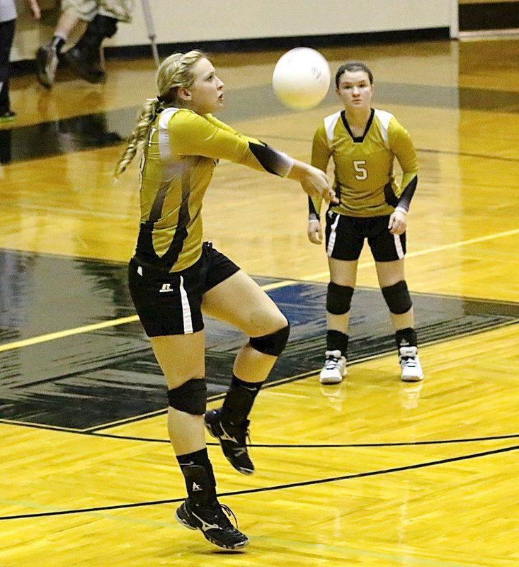 Image: Jaclynn Lewis(13) bumps the ball up to her teammates.