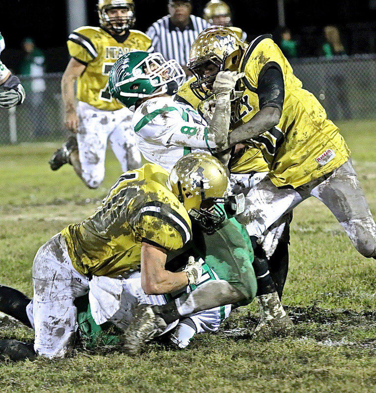 Image: Coby Bland(40) hits a Bobcat ball carrier low while teammate TaMarcus Sheppard(10) hits him high to help the Italy Gladiators deliver a knockout punch to visiting Kerens and claim the district title for the 3rd consecutive season.