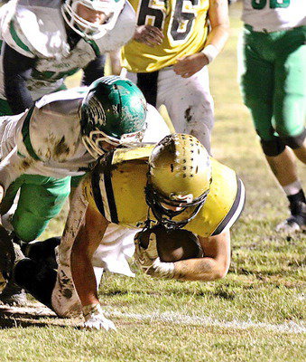 Image: Italy’s Coby Bland(40) pounds his way across the goal line for a touchdown.