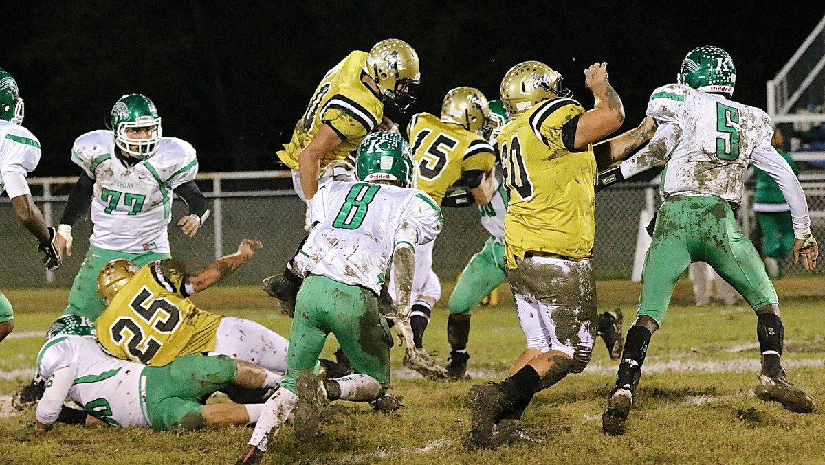Image: Fullback Shad Newman(25) leads the way for a leaping Coby Band(40) who has room to run with blocking help from Cody Boyd(15) and Kevin Roldan(60).