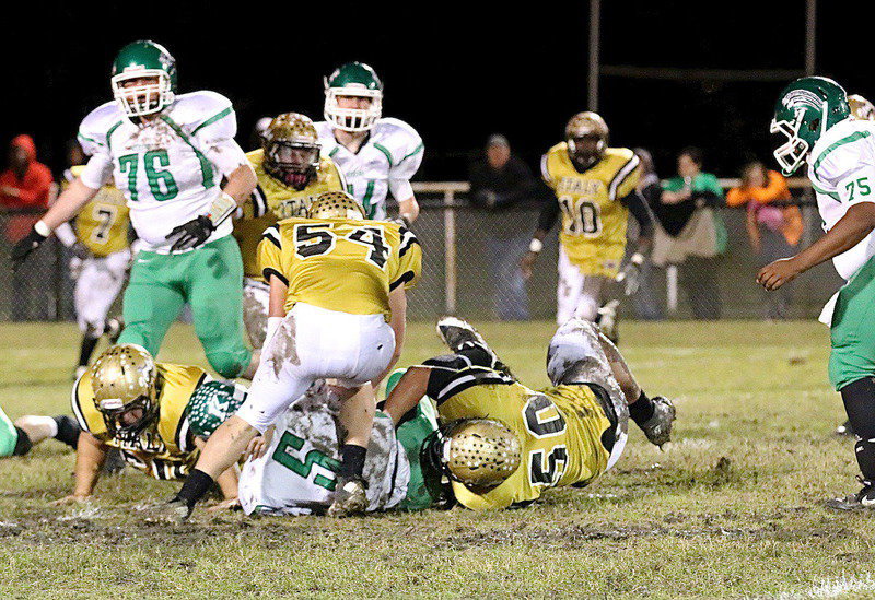 Image: Zain Byers(50) tackles the Bobcat quarterback for a loss.