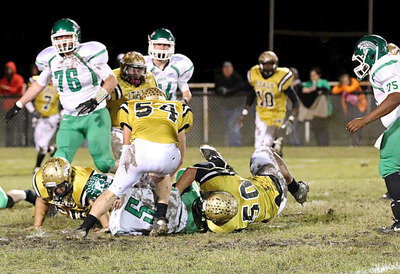 Image: Zain Byers(50) tackles the Bobcat quarterback for a loss.