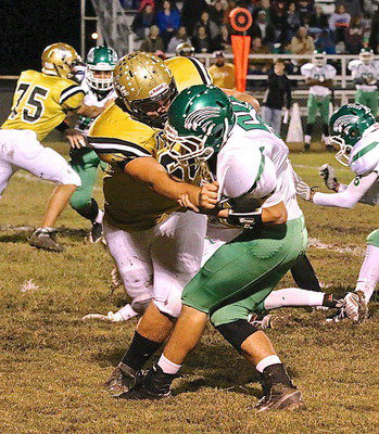 Image: Italy’s Cody Medrano(75) and Kevin Roldan(60) move Bobcat defenders.