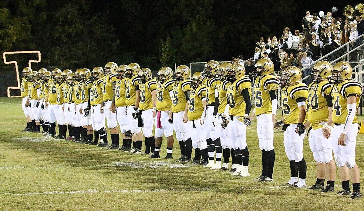 Image: The rest of the Gladiator lineup during the ceremonial pre-game coin toss.