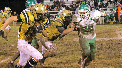 Image: Senior guard Zain Byers(50) hustles downfield to throw a block for junior tight end/receiver Cody Boyd(15) who reaches the first down marker.