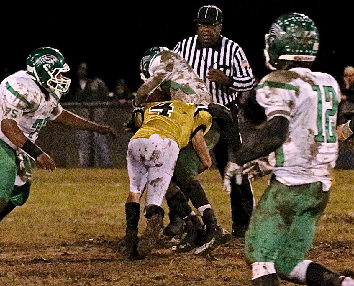 Image: Senior linebacker Justin Wood(4) form tackles a Bobcat back.