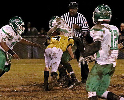 Image: Senior linebacker Justin Wood(4) form tackles a Bobcat back.