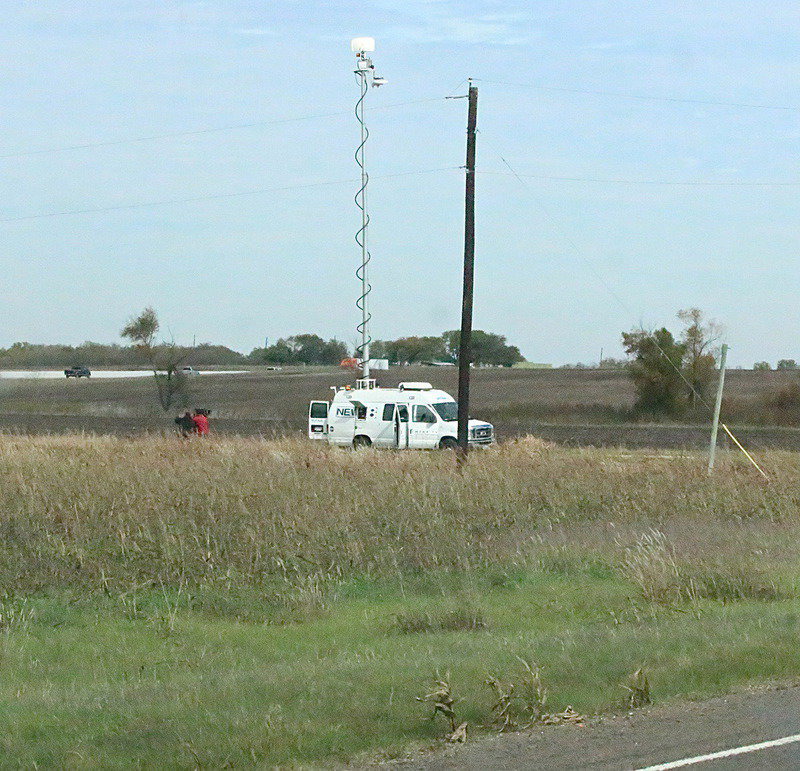 Image: News vans out of Dallas setup camera perches around Milford.