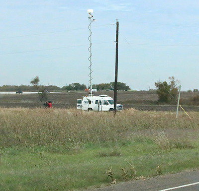 Image: News vans out of Dallas setup camera perches around Milford.