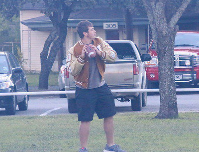 Image: Zain Byers throws with the kids before getting a burger.