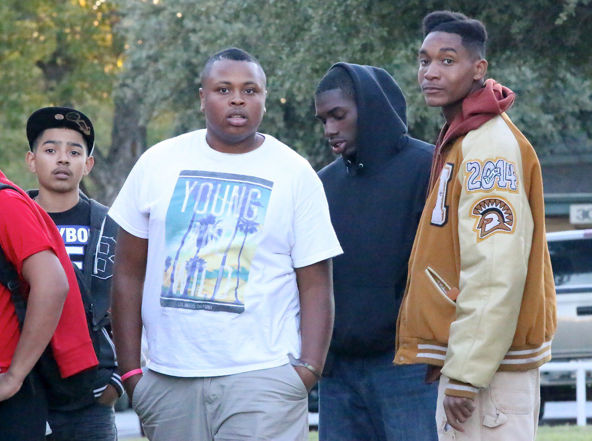 Image: Marcos Duarte and Gladiator seniors Darol Mayberry, TaMarcus Sheppard and Tre Robertson are ready to bite into bi-district burgers.