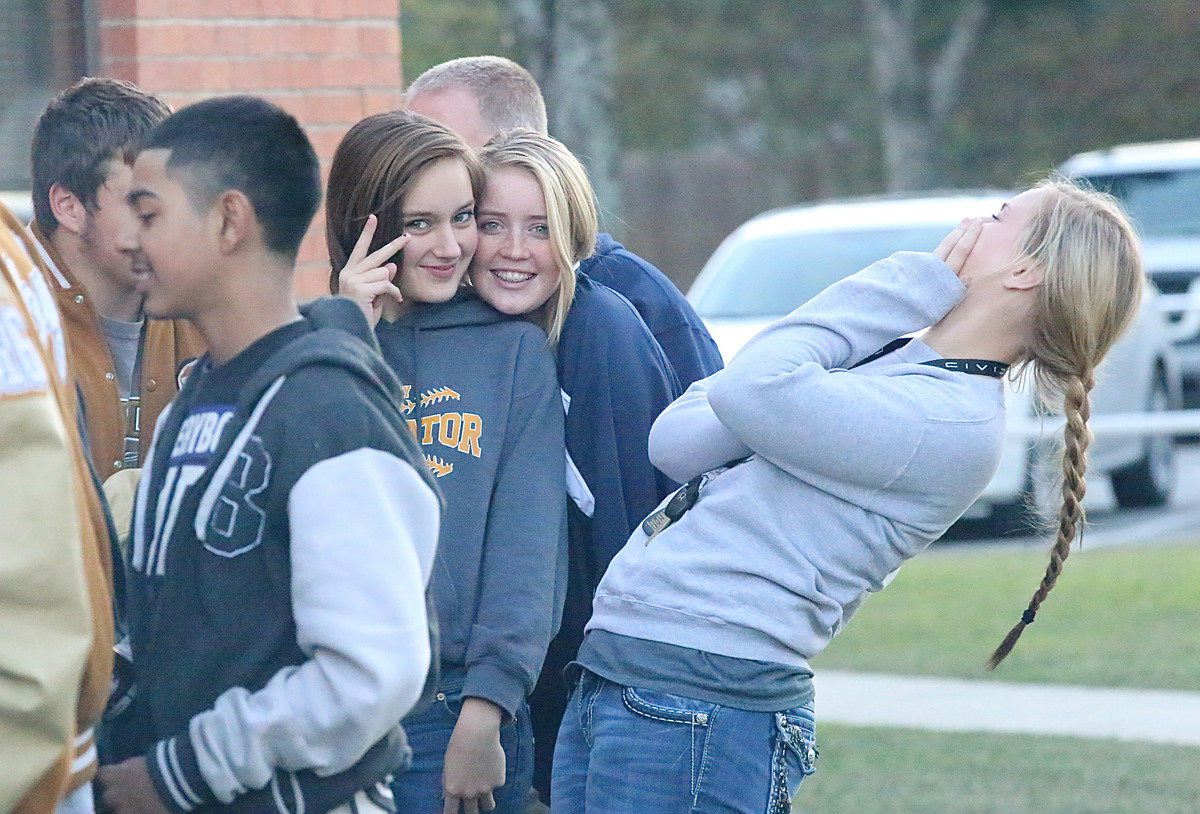 Image: Jozie Perkins and Hannah Washington cheese it up on bi-district burger day while Maddy Washington opts out of this photo…almost.
