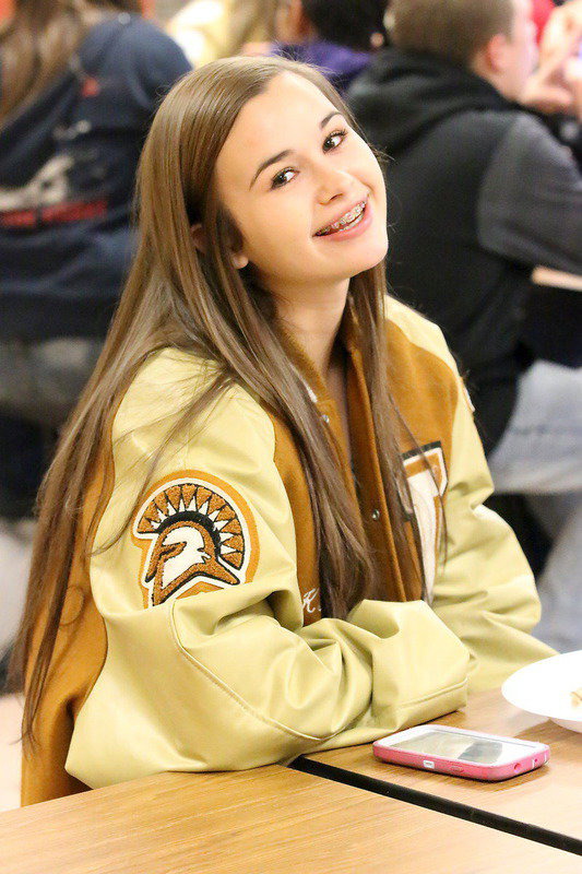 Image: Cheeseburgers and fries bring a smile to trumpeter Amber Hooker.